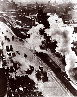 early photo of train and vehicular traffic on Delaware Avenue